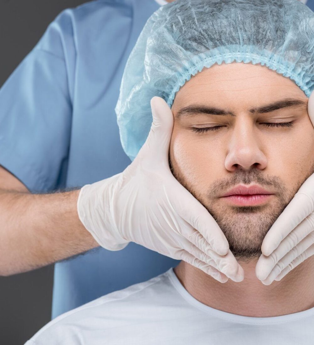 bearded handsome man with closed eyes ready to facelift, isolated on grey